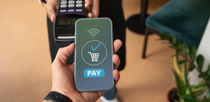 Customer making a mobile payment using a smartphone